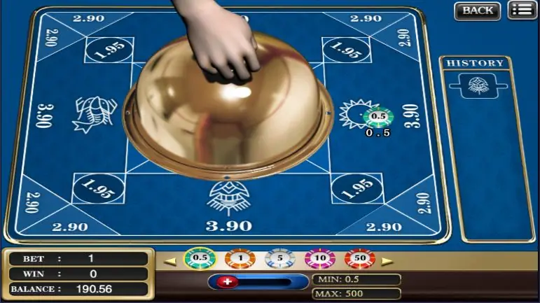 A dealer's hand lifting the brass cover to reveal the die